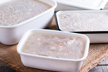 Homemade jelly meat with in the container on the table. Holodets