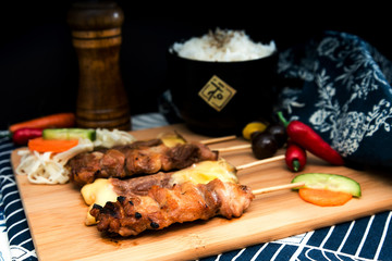 tasty beef steak kabobs with vegetables on a slate plate