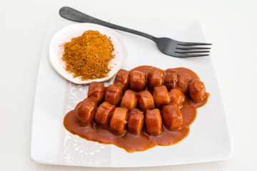 Tasty german sausage served with sauce