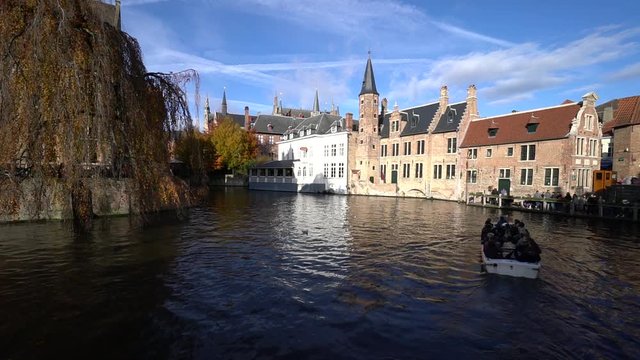 Tourist boats on Bruges canal in Belgium. Bruges is one of the popular city with touristic attractions in Belgium.