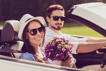 Married family, friendship, trip, relax, chill, escape, speed ride. Well dressed brunet driver in...