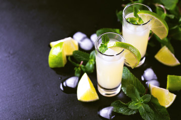 Italian lemon lime liqueur limoncello with ice and mint