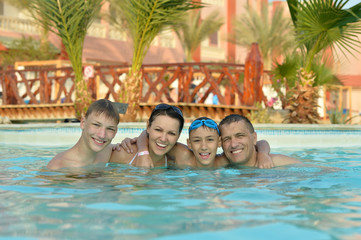 Obraz na płótnie Canvas family relaxing in the pool