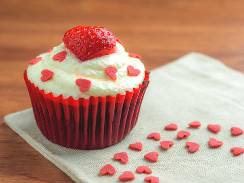 Close-up image of red velvet strawberry cup cake with heart shape sugar, Valentine concept, Copy space
