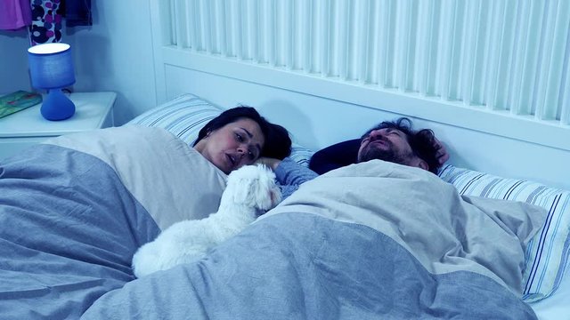 Woman at night not able to sleep husband snoring strong slow motion