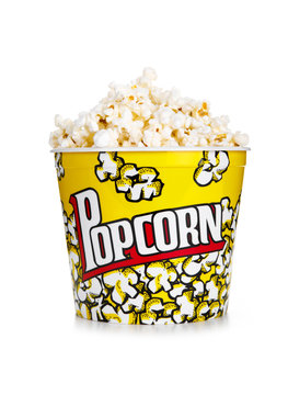Full yellow bucket of popcorn, isolated on the white background.