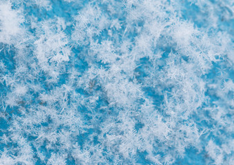 white snowflakes on a blue background