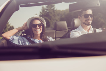 Married family, friendship, trip, relax, chill, escape, speed ride, valentine. Closeup of well dressed brunet driver in eyewear, femenine gorgeous cute brunette lady on way to sweet honeymoon