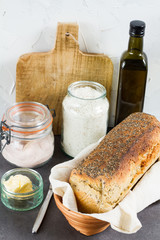 Handmade spelled bread. White background. Salt, flour and butter.