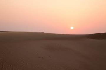 Fototapeta na wymiar Dunes at sunset in a desert near Dubai