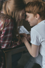 beautiful young lesbian couple kissing and holding hands