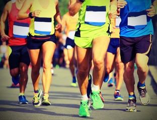 athletes run fast during the racing race with vintage style effect