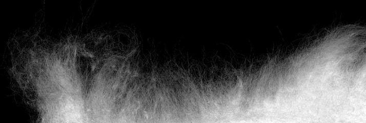 Medical cotton wool isolated on a black background. Highly detailed texture.
