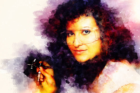Woman holding airbrush gun and softly blurred watercolor background.