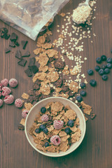 flakes with berries in brown bowl