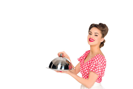 beautiful smiling woman in retro clothing with serving tray in hands isolated on white