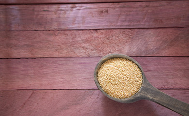 Organic amaranth seed in wooden spoon
