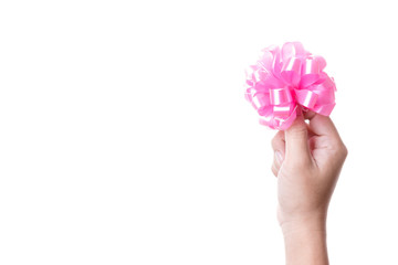 Hand holding pink ribbon for gift decoration