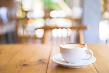 Cup of coffee with fern tree pattern milk foam