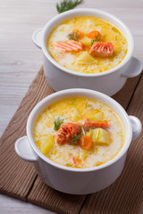 Salmon soup. Finnish salmon soup Lohikeitto. vertical