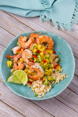 Shrimps with mango avocado and red pepper salsa on cauliflower rice