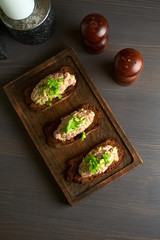 bruschetta, on slices of toasted baguette garnished with basil