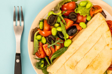 Vegetarian Style Courgette and Cherry Tomato Flatbread With A Fresh Mixed Salad