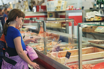Children choose products in the Sweden fish market, Gothenburg