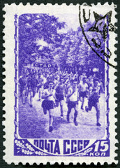 MOSCOW, RUSSIA - DECEMBER 23, 2017: A stamp printed in USSR shows Foot race, series Sport, 1948