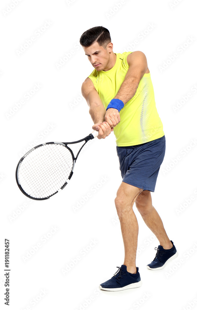 Canvas Prints Portrait of handsome man playing tennis against white background