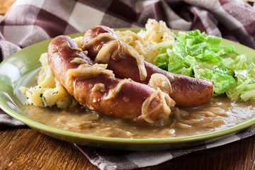 Bangers and Mash. Baked sausage in onion gravy