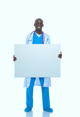 Male doctor holding empty placard. Doctor. Billboard