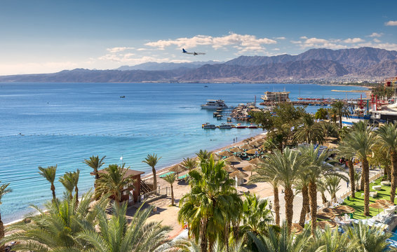 Central beach and marina in Eilat - famous resort and recreation city in Israel. This serene location is a very popular tropical getaway for Israeli and European tourists. 