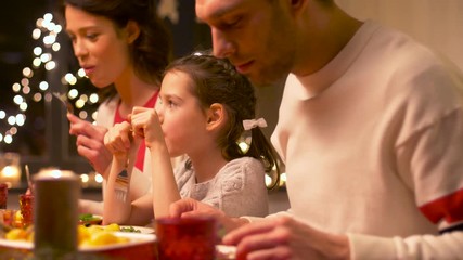 happy family having christmas dinner at home