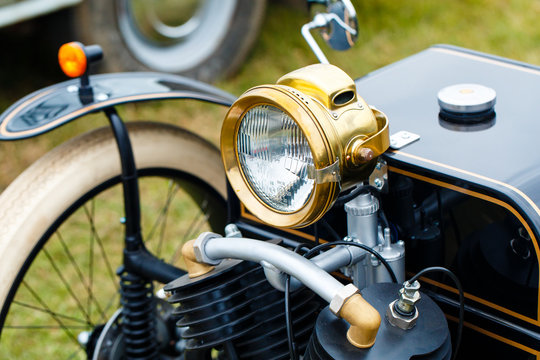 Classic black motorbike with three weels