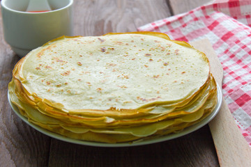 homemade freshly baked pancakes coated with butter