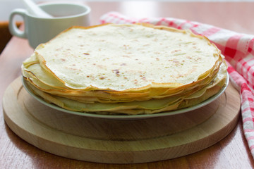 homemade freshly baked pancakes coated with butter