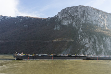 Orsova, Romania - 01.01.2018: Large barges making their way through the Danube gorge