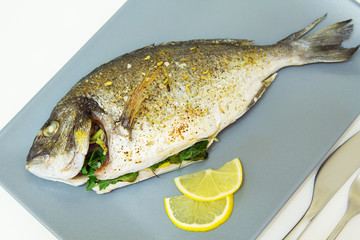 Baked fish dorado. Close-up, selective focus.