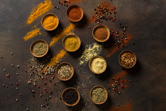 A Variety of Middle Eastern Spices are Displayed in Wooden Bowls