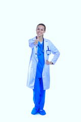 Beautiful young woman in white coat posing with hand in pocket. Woman doctor