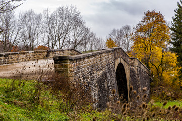Fototapeta na wymiar Historic Casselman Stone Arch Bridge - Autumn Splendor - Garrett County, Maryland