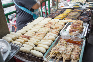 Roasted Pisang Awak banana on a barbecue grill for sell, Wang Lang market, Bangkok, Thailand