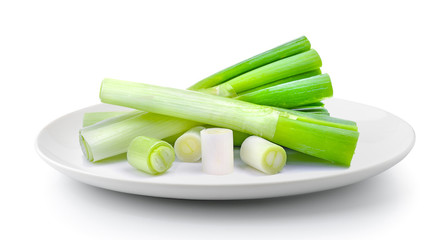 japanese bunching onion in plate isolated on a white background