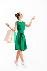 Full length portrait of a cheerful young girl