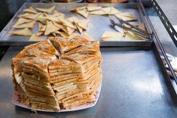 Sliced bread with sweet chili paste and sweeten dried pork on stainless plate for sell, Wang Lang market, Bangkok, Thailand