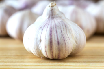 whole garlic on wood table