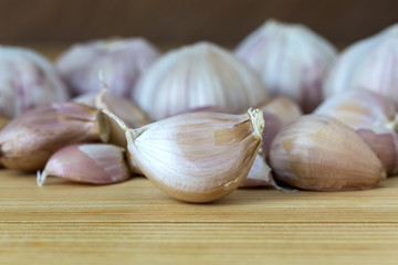 whole garlic on wood table