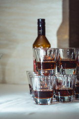 Pyramid of glasses of alcohol made in a pyramid for event party or wedding ceremony