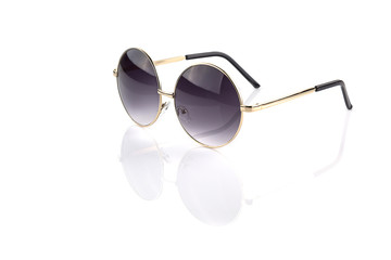 Round golden glasses isolated on white